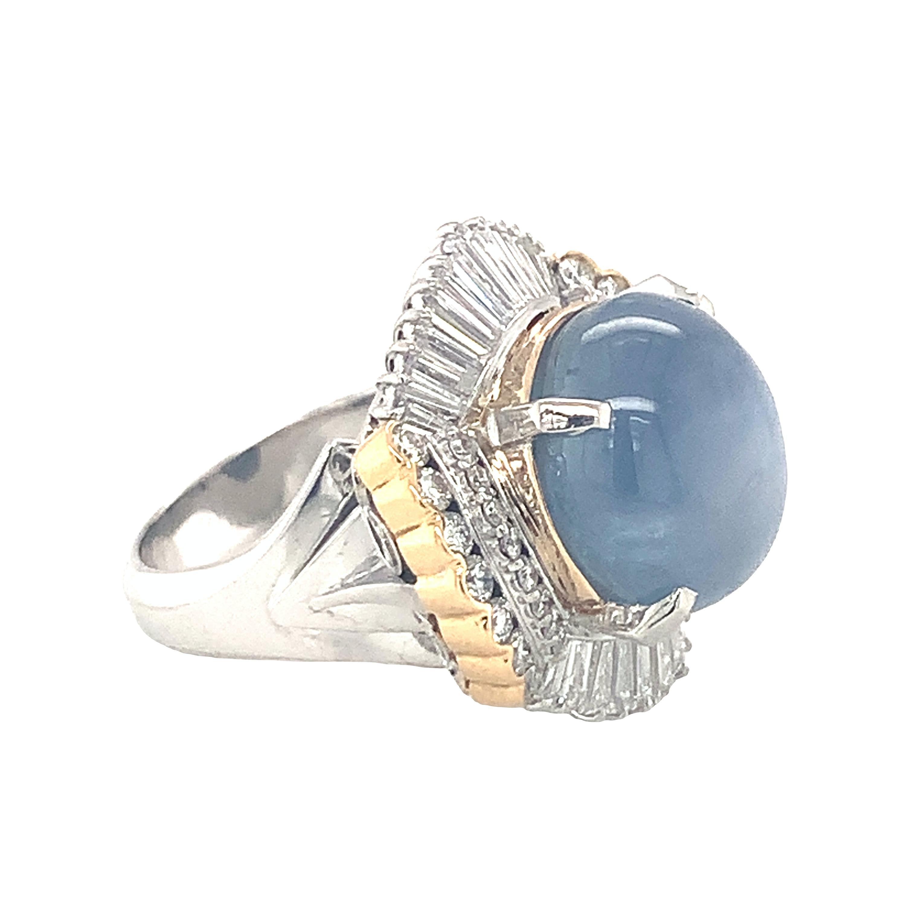 Mid-century platinum and gold ring set with a star sapphire