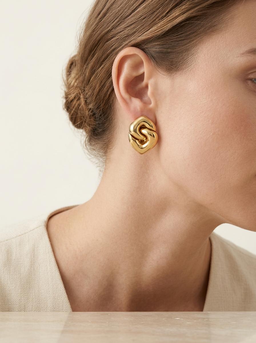 Signed Bvlgari double heart gold earclips, 1980s designer jewelry